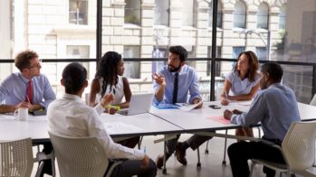 people working in office to discuss product launch