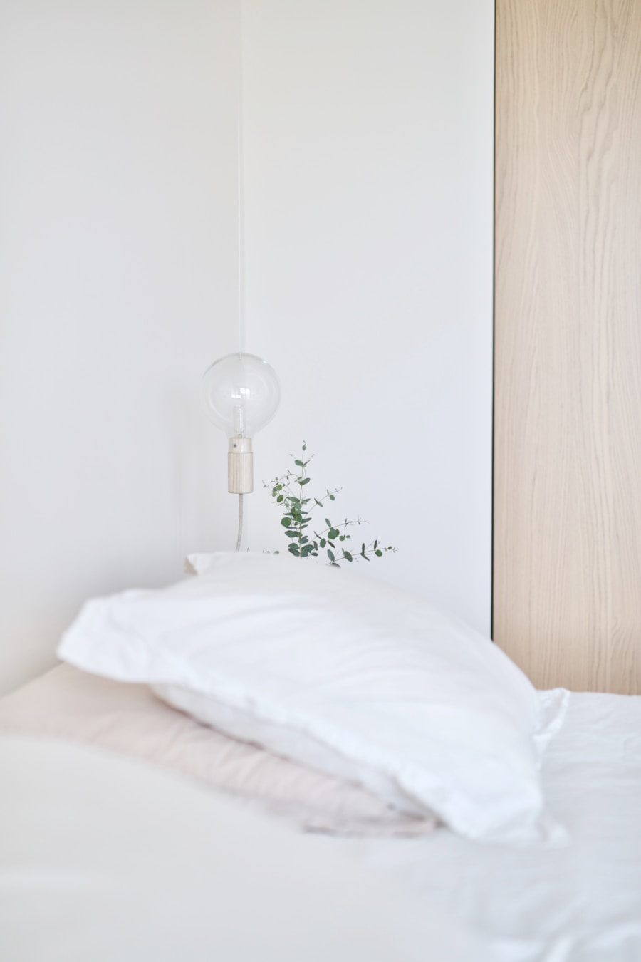 Cozy minimal bedroom with warm morning light representing Airbnb Belong Anywhere platform built around human connection