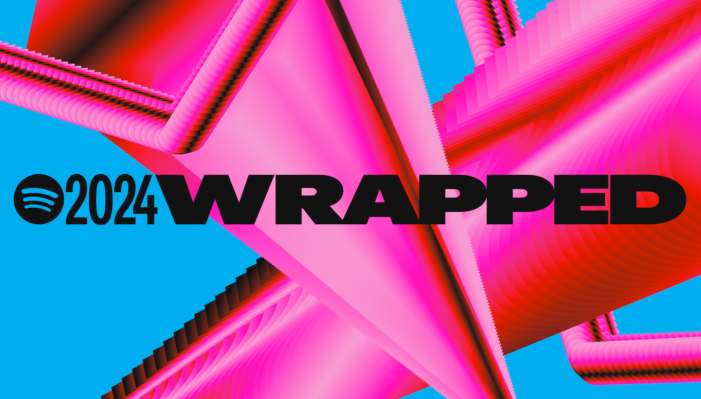 A phone showing a colorful Spotify Wrapped year-in-review card with a listener's top artists and minutes streamed