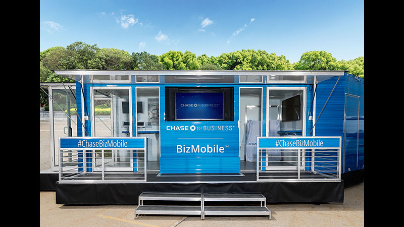The blue Chase BizMobile pop-up trailer branded with hashtag ChaseBizMobile, a traveling small-business banking activation